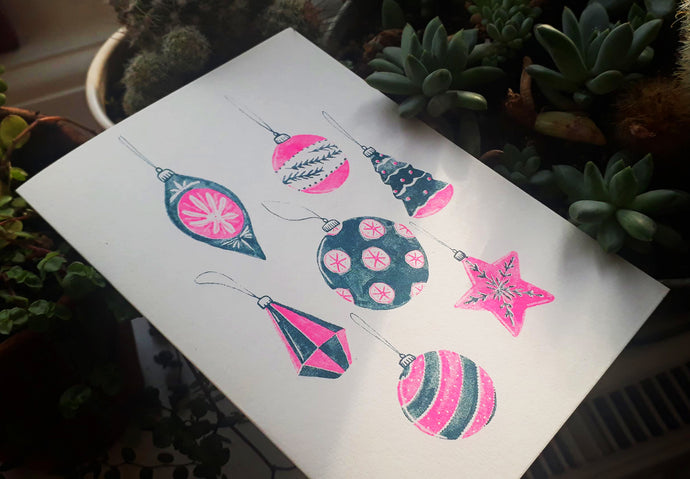 Pink Neon Bauble card by Delphine Jones